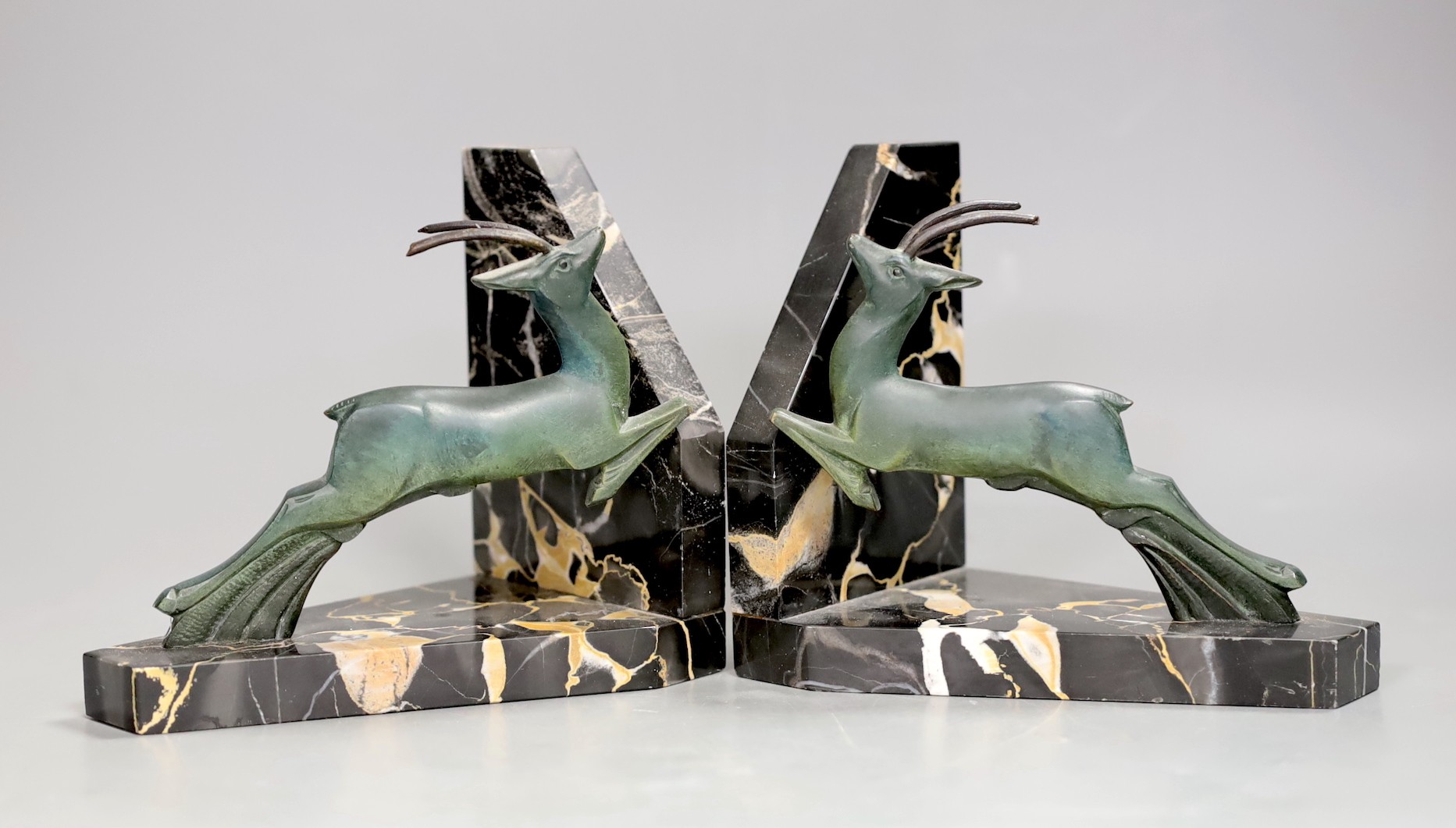 A pair of Art Deco bronze 'antelope' bookends. 12.5cm high